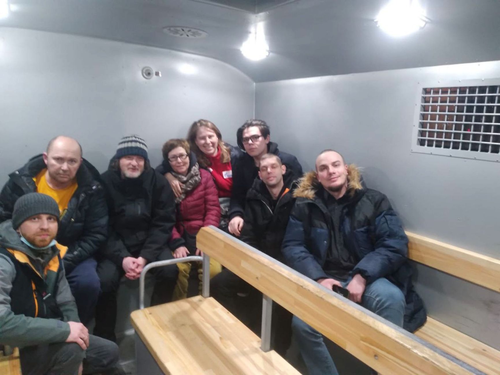 Mark Bennetts (third from left) in a police van in Moscow, February 28, 2022