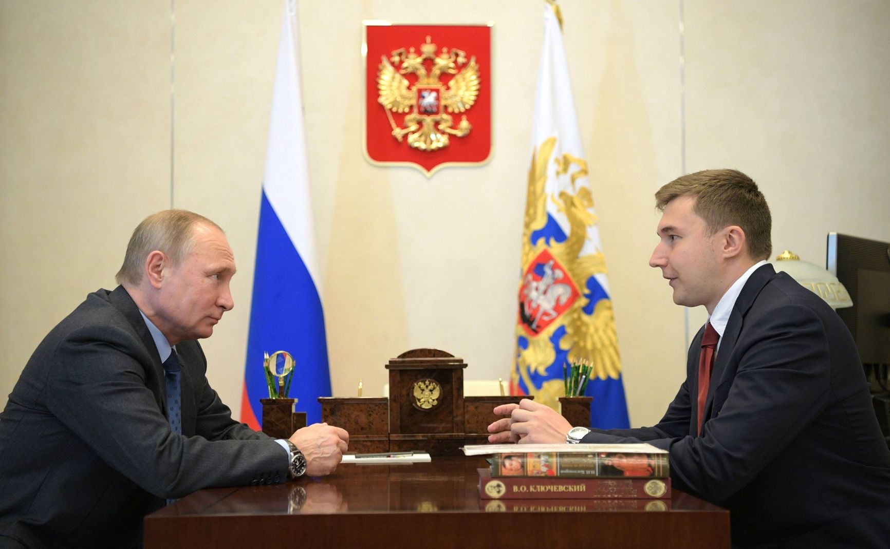 Sergey Karjakin being received by Putin