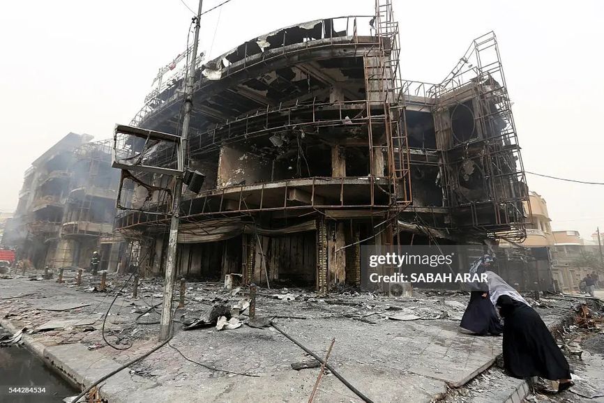 Последствия взрыва бомбы в Багдаде в 2016 году