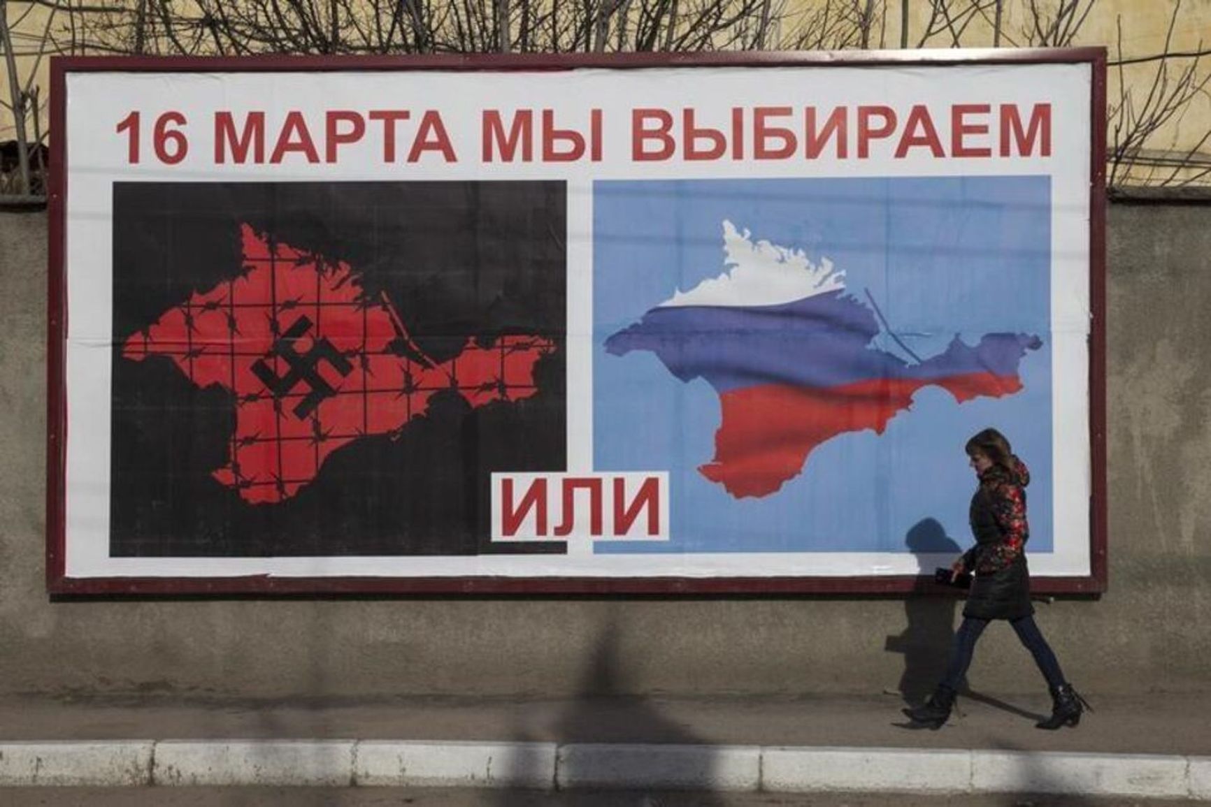 A billboard in Crimea before the referendum reads “On March 16 we choose [this] or [this]”
