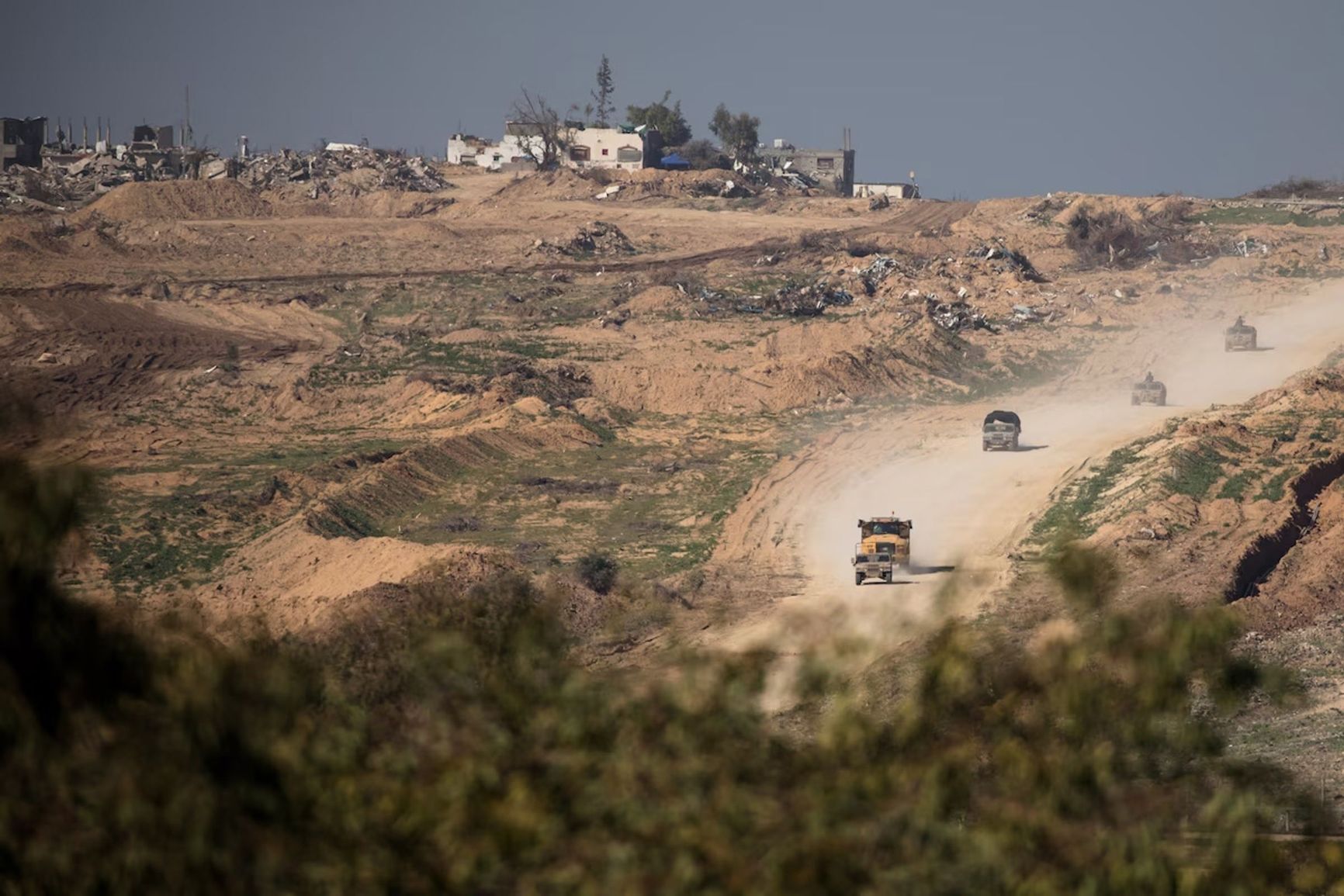 An Israeli army convoy moves along the border of the Gaza Strip.