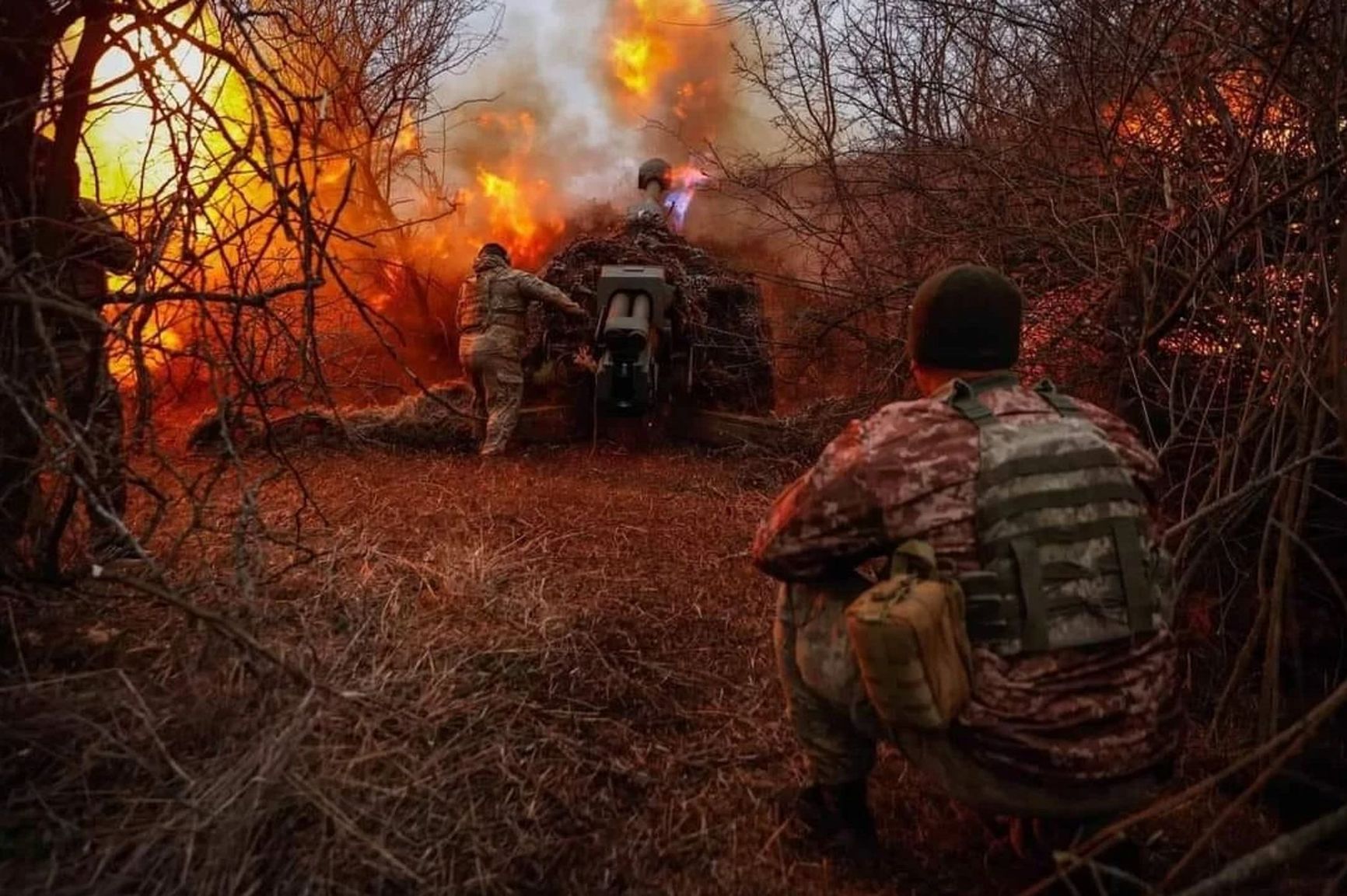 Ukrainian artillerymen fire from a D-30 howitzer near Kherson, Mar. 12, 2024