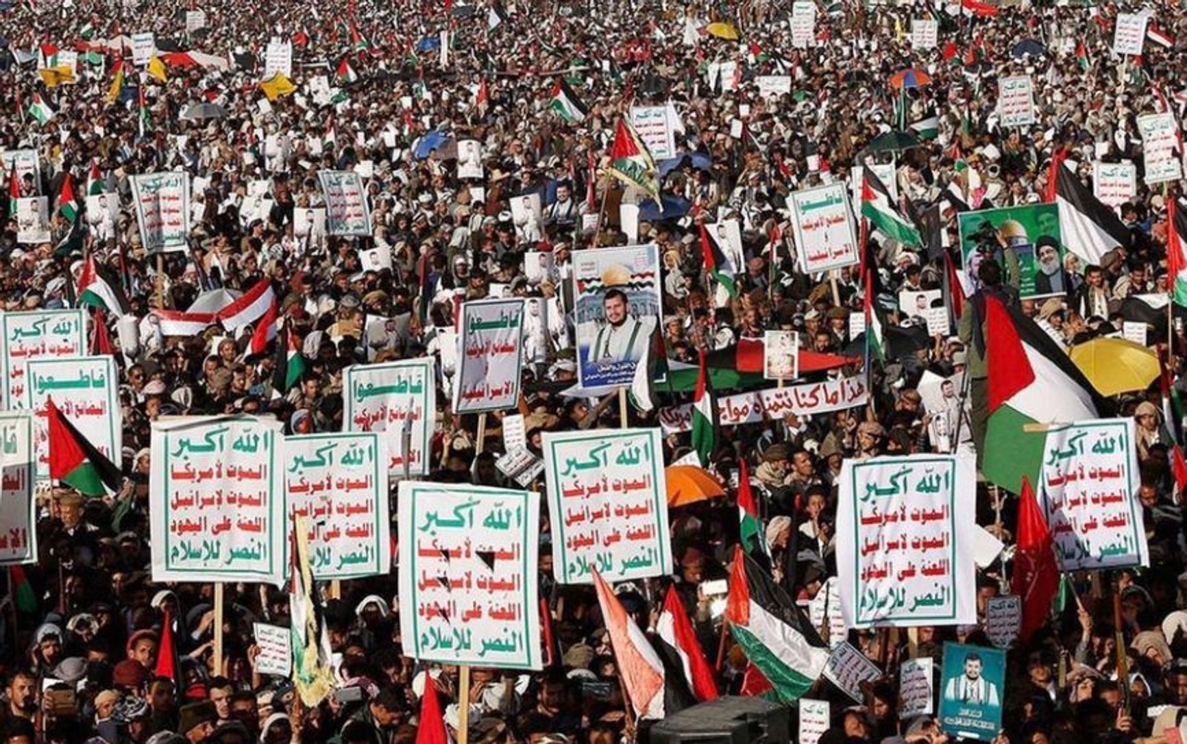 A Houthi demonstration with posters and placards reading: “God Is the Greatest, Death to America, Death to Israel, A Curse Upon the Jews, Victory to Islam!”