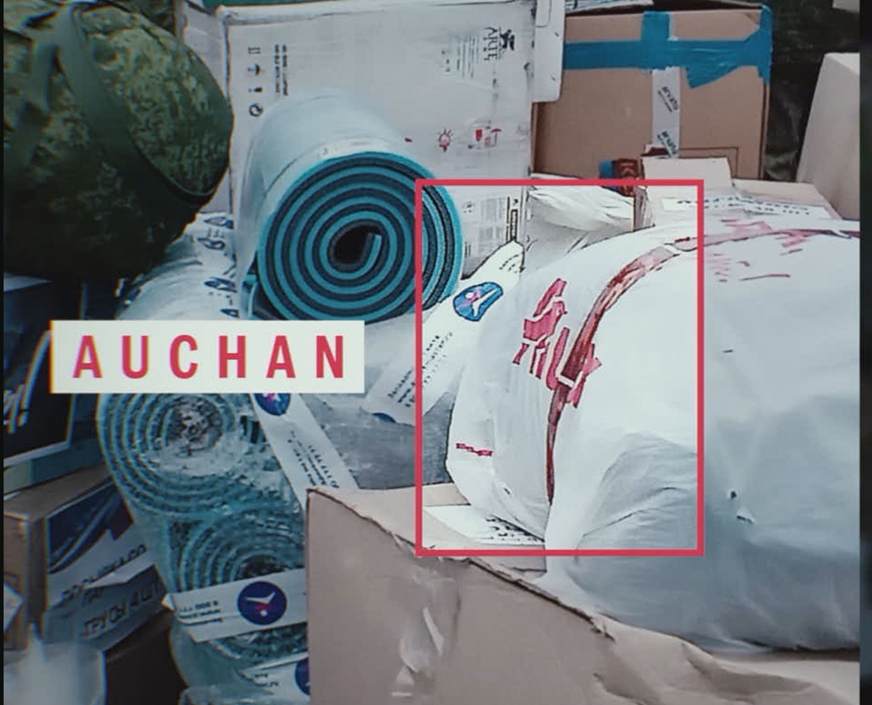 In the video, where the Russian servicemen are thanking volunteers for their help, you can see items in Auchan's branded packaging