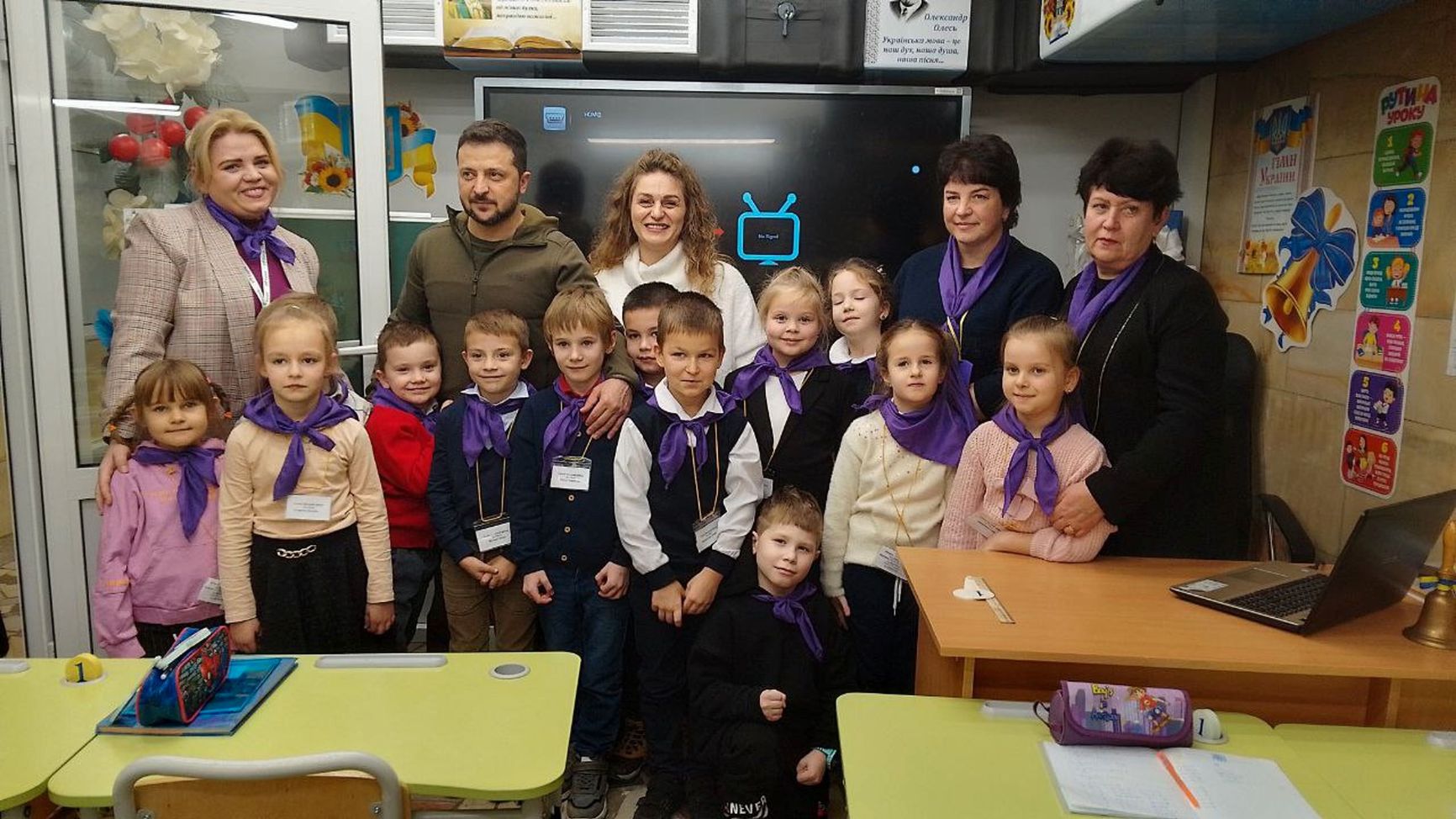President of Ukraine Volodymyr Zelensky with children during his visit to the subway school. 