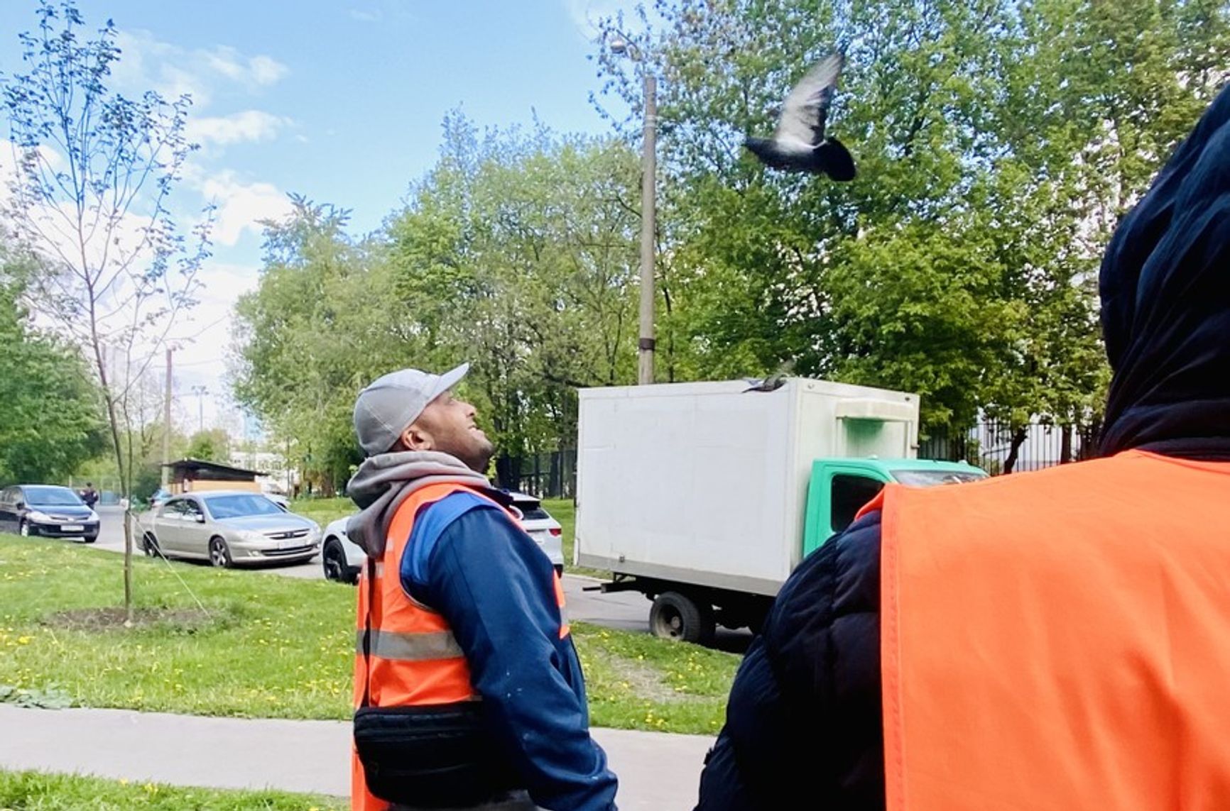 A municipal worker looks out for drones in Moscow’s Pechatniki district