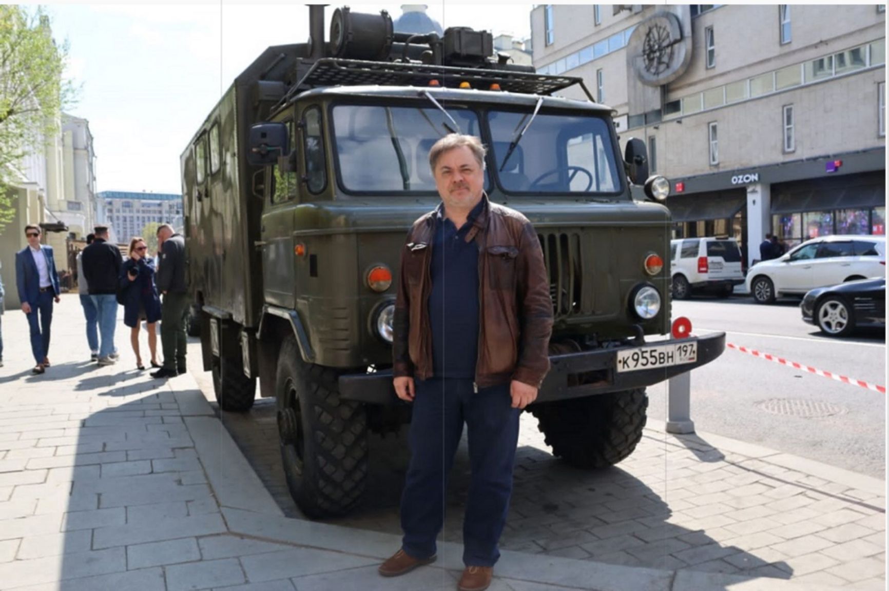 Actor Andrei Leonov and the vehicle he handed over to the Russian army, photographed near the Lenkom Theater building