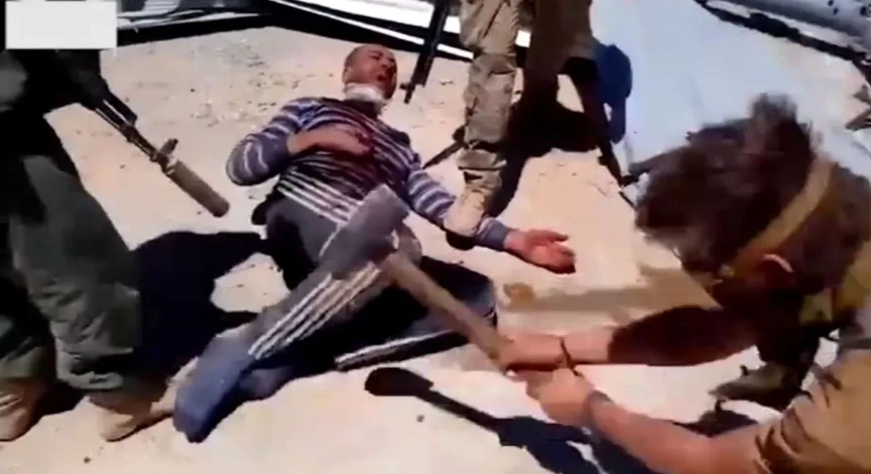 Screenshot from the video of the execution of a Syrian by PMC Wagner mercenaries